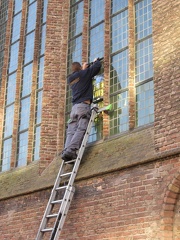 Guy Fixing Glass on De Grote Kerk